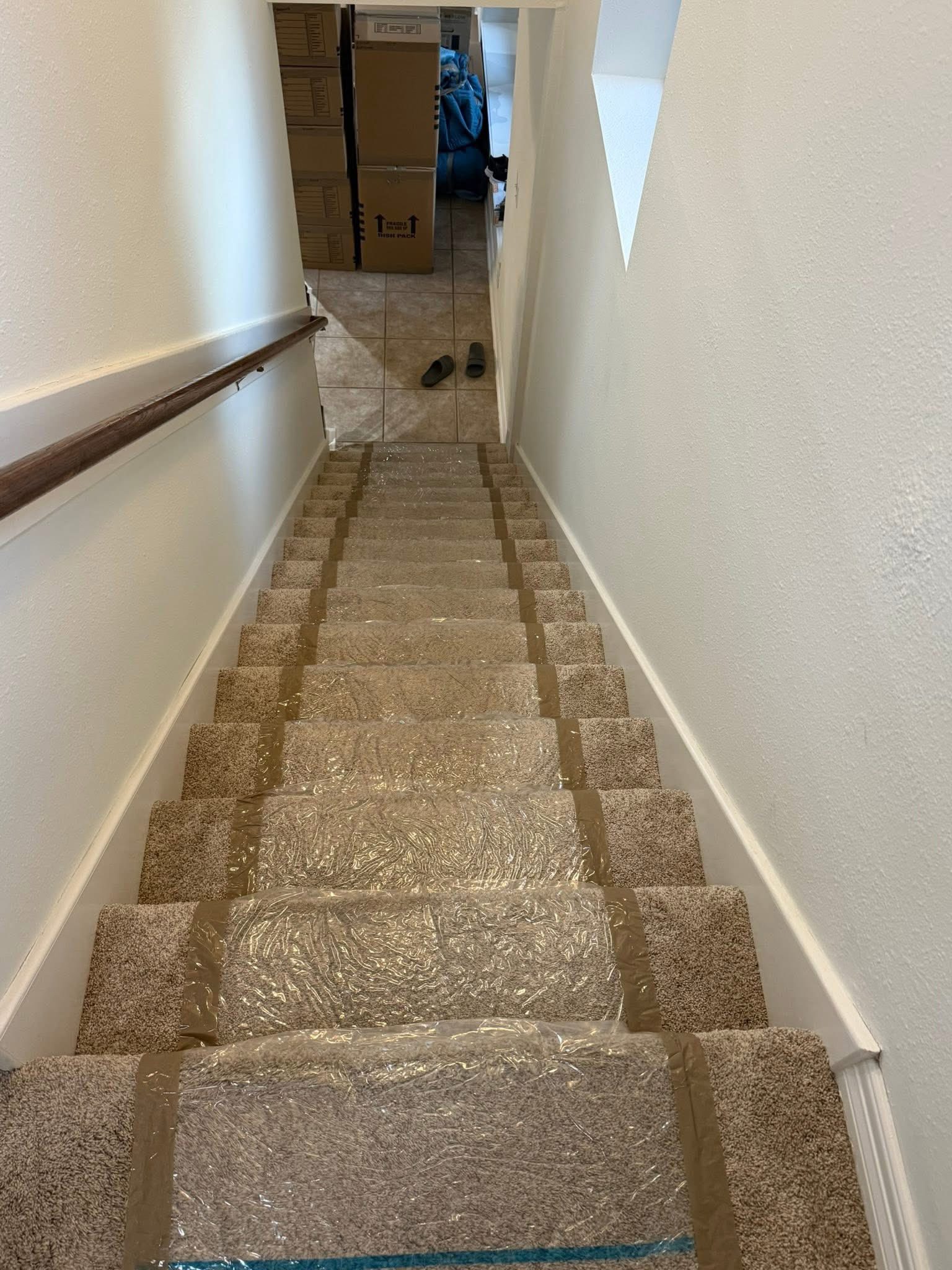 Stair protection laid down by movers during a Dallas Fort Worth move