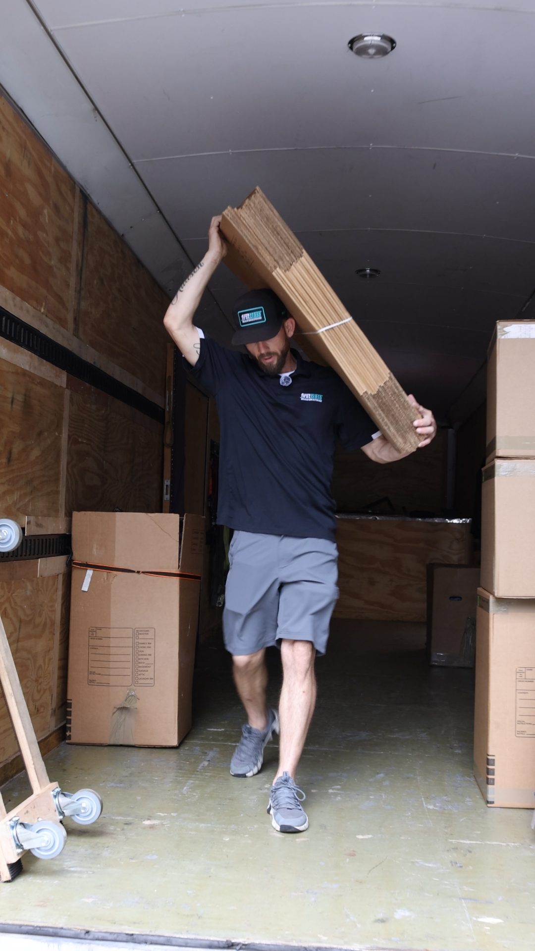 Mover carrying boxes during a move in the Dallas Fort Worth area