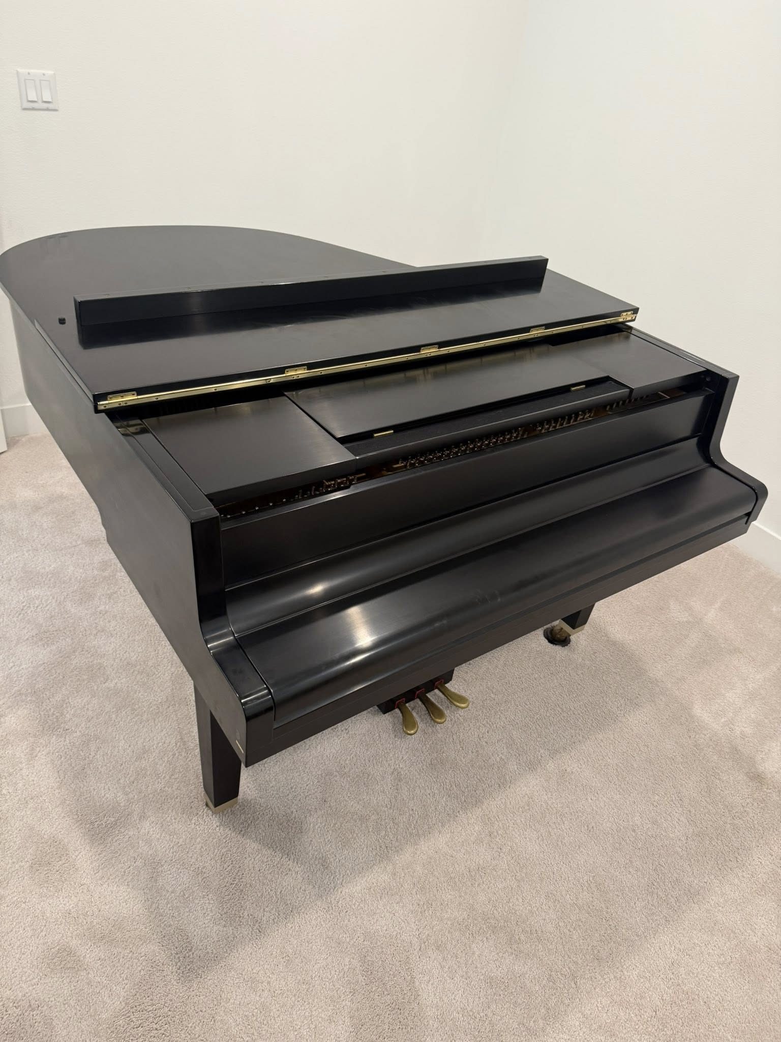 Grand piano wrapped for transport by specialty movers in Dallas Fort Worth